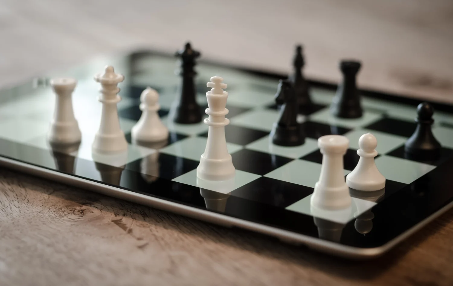 Chess pieces on a tablet: strategy before moves